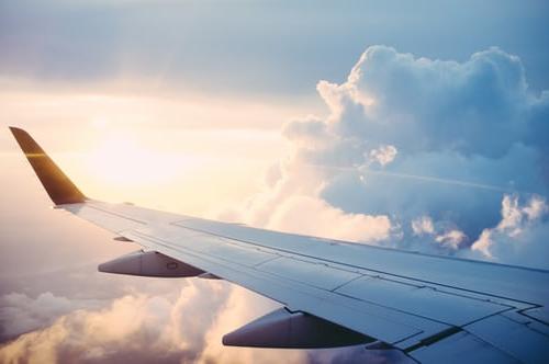 Passenger view ov an airliner wing and the sky.